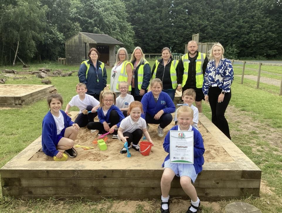 Oasis Academy pupils and staff with sandpits