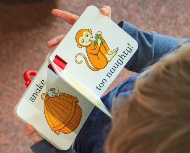 child looking at a book