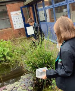 Pupils exploring the pond at Church Hill Middle School